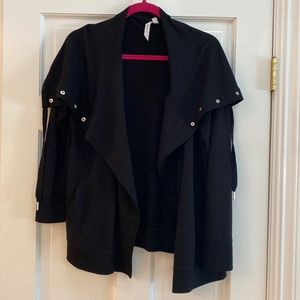 New black sweatshirt with silver snap closure at top-smoke free home